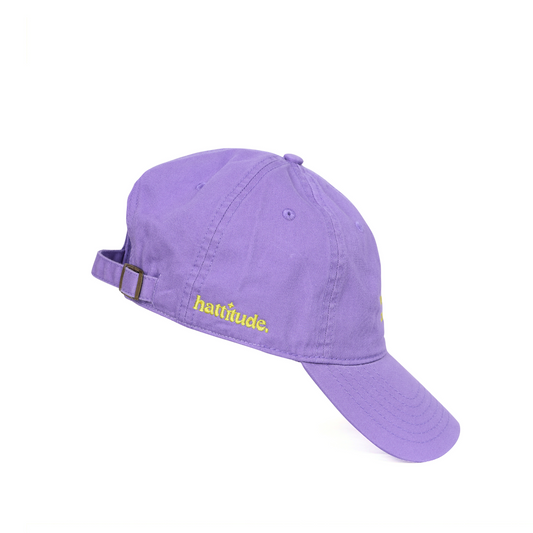 Purple cap with yellow text on a white background