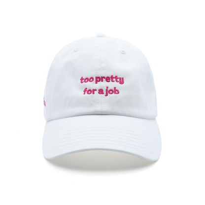 White baseball cap with pink text 'too pretty for a job' embroidered on the front. trendy statement cap for women.