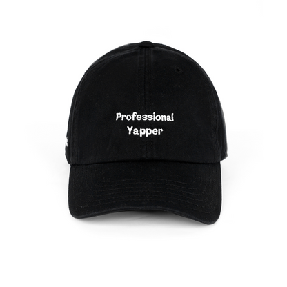 Black cap with embroidered text “Professional Yapper,” funny sarcastic lifestyle cap.